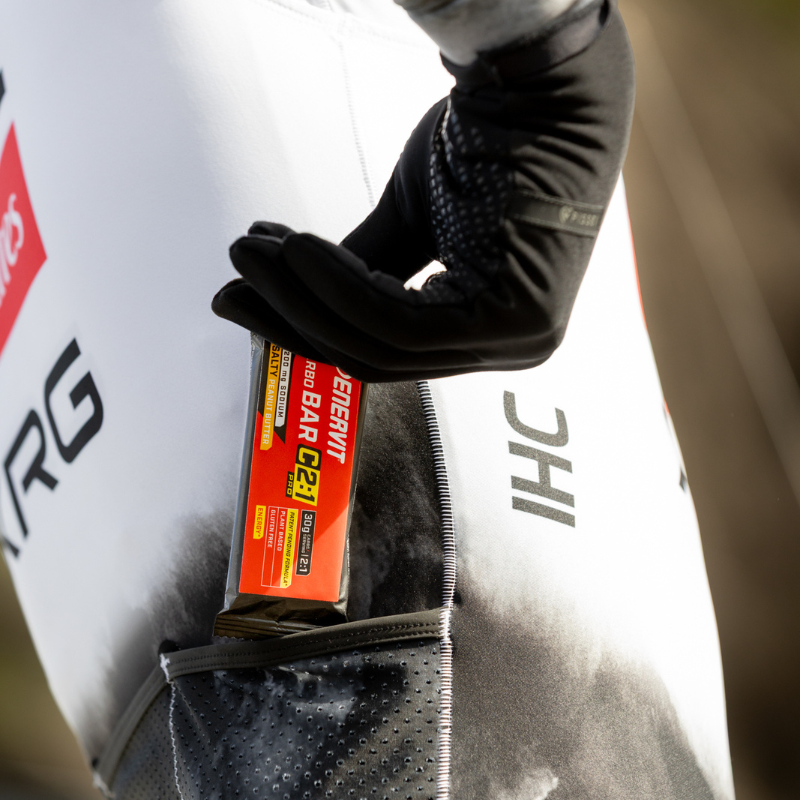 Athlete with Enervit C2:1PRO Carbo Bar